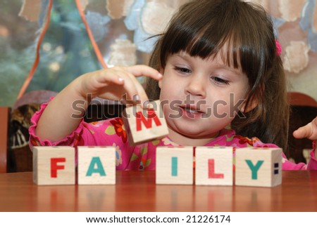 The girl and toy cubes
