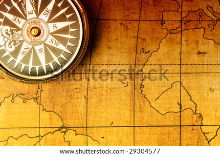 Old compass and map background. Old gold color