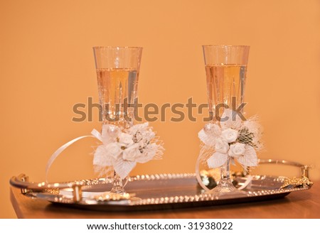 Wedding glasses. Glasses with a champagne decorated decorative flower