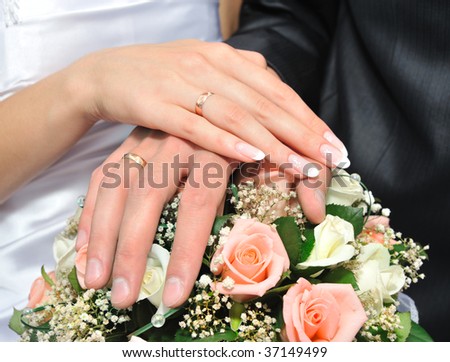 Hands of a newly-married couple