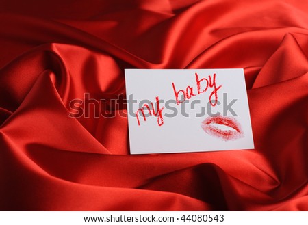 Note on red silk. With an inscription \