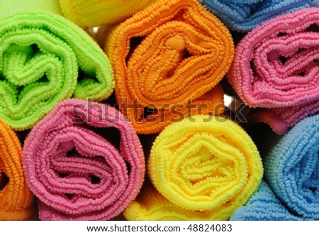 Double color towels curtailed into a roll. A photo close up