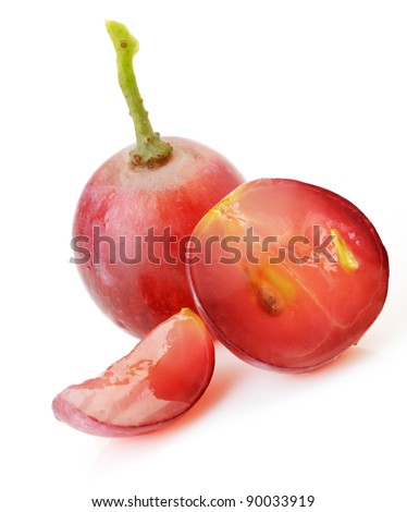 red grapes. Cut on segments grapes berry. It is isolated on a white background