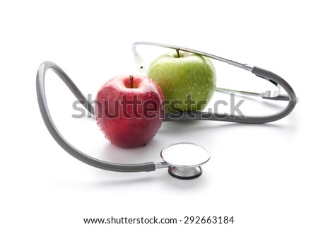 Protect your health with healthy nutrition: Stethoscope and apple