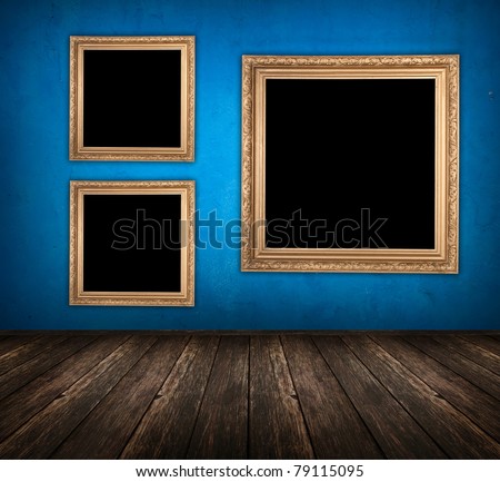 blue empty room with wooden floor and empty frame hanging on the wall