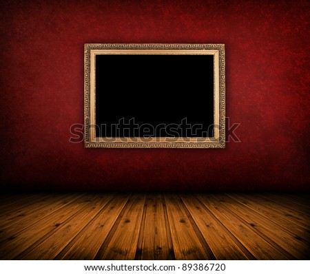 dark vintage red room with empty frame hanging on the wall