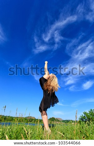 Young girl doing gymnastic outdoor, Blue sky background (4)
