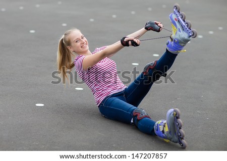 Roller skate girl skating. Young woman putting on skates going rollerblading in urban city park