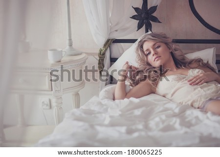 beautiful girl at her bedroom in tender feelings.