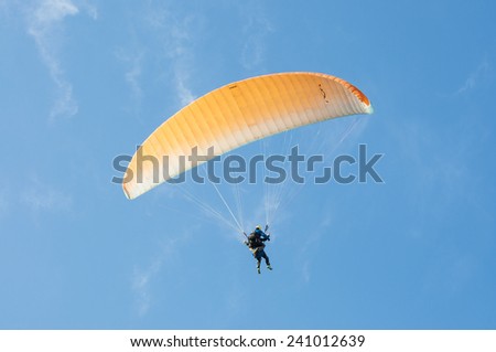 SANTA POLA - MAY 3, 2013: First flight with a tandem paragliding instructor in Santa Pola, Alicante, Spain on May 3, 2013.