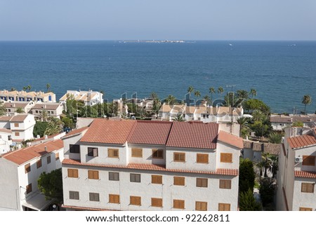 Views of Santa Pola town with Tabarca islet at the background. It is a coastal town located in the comarca of Baix Vinalopo, in the Valencian Community, Alicante, Spain, by de Mediterranean Sea.