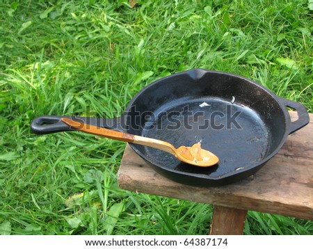 pig-iron pan and wood spoon
