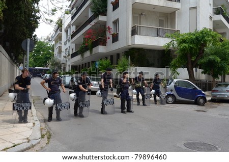 ATHENS, GREECE - JUNE 15: General strike against new $40.36 billion austerity program of tax hikes and sell-offs of state property on June 15, 2011 in Athens, Greece. Greek riot police block access to central square