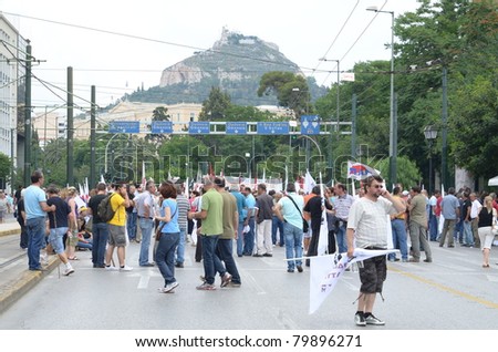 ATHENS, GREECE - JUNE 15: General strike against the Greek parliament discussed new $40.36 billion austerity program of tax hikes, spending cuts and sell-offs of state property on June 15, 2011 in Athens, Greece
