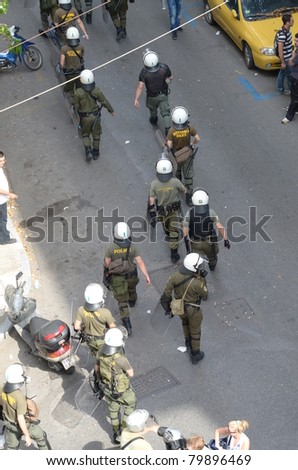 ATHENS, GREECE - JUNE 15: General strike against new $40.36 billion austerity program of tax hikes and sell-offs of state property on June 15, 2011 in Athens, Greece. Greek riot police block access to central square
