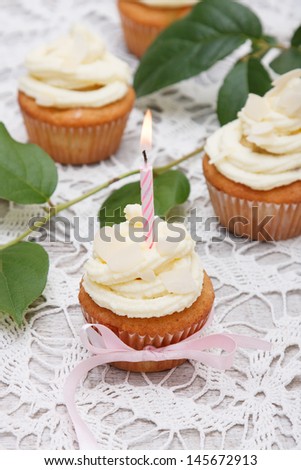 tasty birthday cupcake with candle