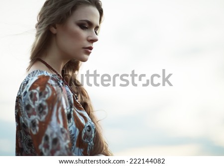 Dramatic portrait of beautiful hippie girl outdoors Boho fashion style Dramatic portrait of beautiful hippie girl outdoors Boho fashion style
