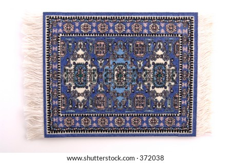 A miniature Persian rug. (isolated, 12 MP camera)