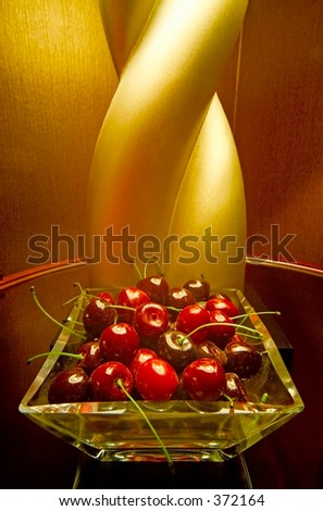 Interior design element (faux cherries) in front of a lamp in an upscale hotel suite in Las Vegas.