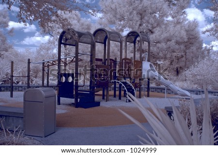 True infrared photo of a Florida resort playground for kids. Focus = the playground set in the middle. Modified camera with 720nm cutoff filter.