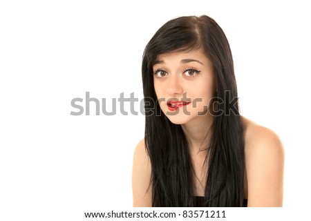 Beautiful brunette girl bit her lip on white background close-up