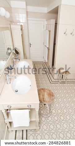 Wooden house bathroom with lots of storage space and light