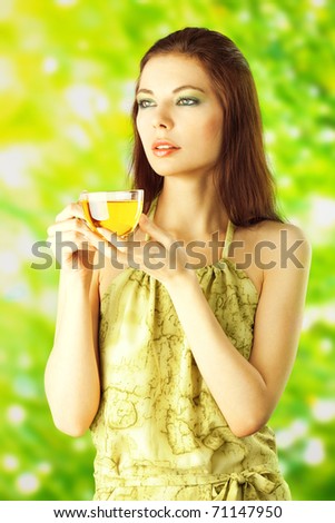 Beautiful Girl Drinking Healthy Green Tea. Healthcare or Herbal medicine concept