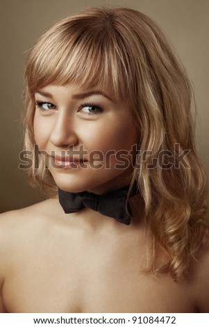 Portrait of a beautiful girl with bow-tie
