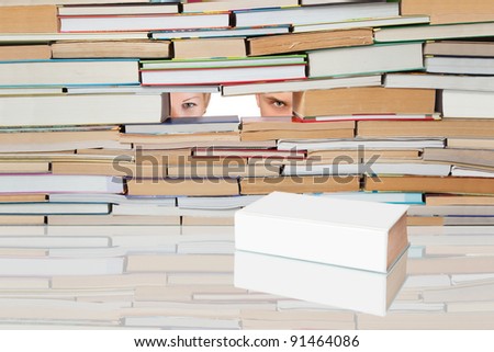 People looking for a number of books on a white book.
