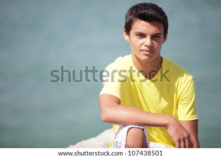 Young teenager sitting in nature