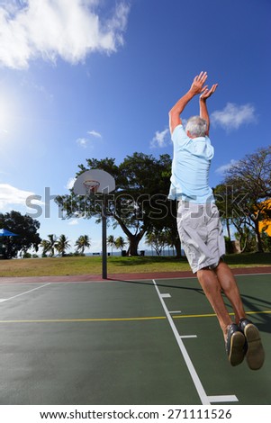 Stock image of a senior making a basketball shot