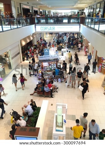 Aventura mall.  AVENTURA - JULY 26: photo of Aventura mall on a busy rainy Sunday. Aventura mall is one of South Floridas largest upscale retail malls July 26, 2015 in Aventura FL, USA.