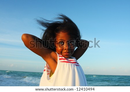 Young girl with her arms behind her head