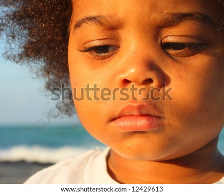 Young child with a sad facial expression