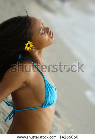 Woman On The Beach With Her Head Tilted Back