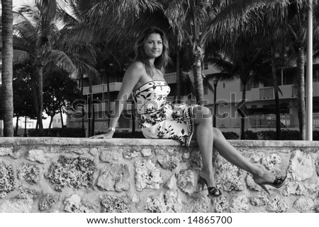 Woman Sitting On A Ledge