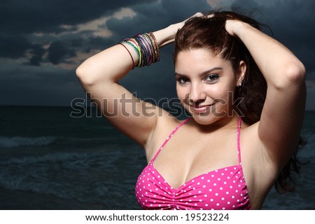 Woman posing with hands on head