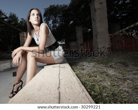 Woman sitting on a ledge