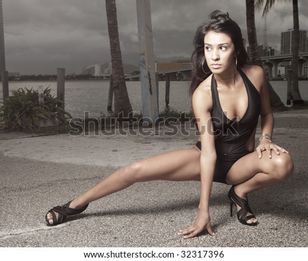 Young woman squatting