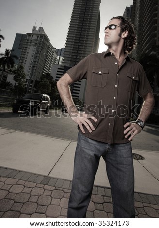 Tall man standing in a urban setting