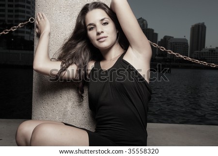 Woman posing with her arms above her head