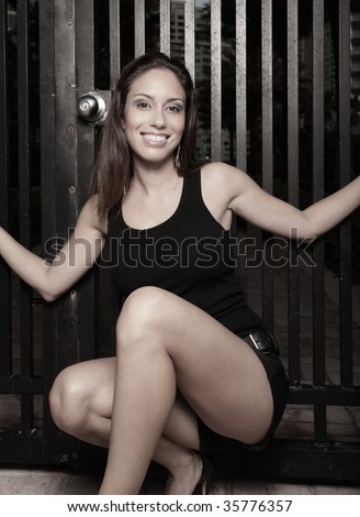 Woman squatting and smiling