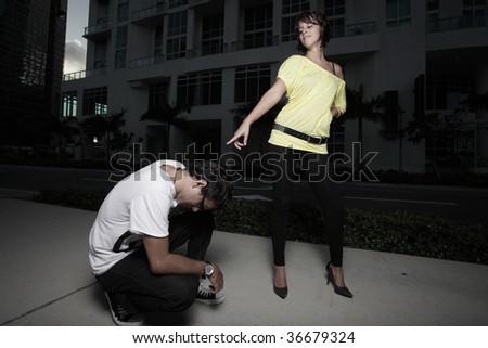 Woman pointing and laughing at the man