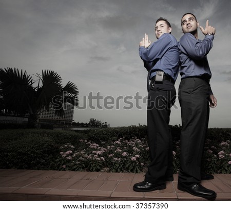 Image of businessmen pretending to be secret agents