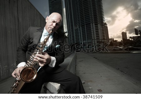 Man playing the sax downtown