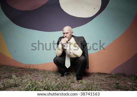 Sad businessman pondering