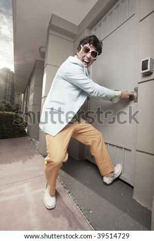 Man trying to pull the door open