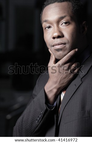 African American businessman with his hand on his chin
