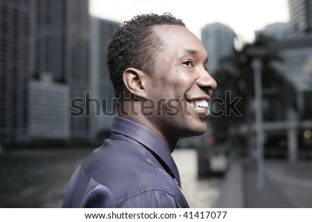 Young African American businessman glancing sideways