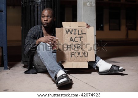 Homeless man with a sign 